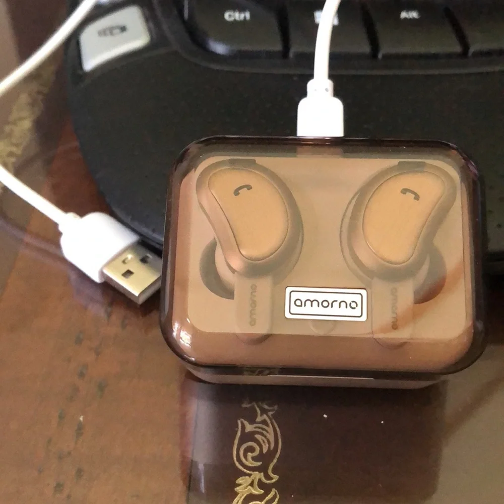 - Blue tooth ear buds. Rose gold. Like new. In case with charge cable.